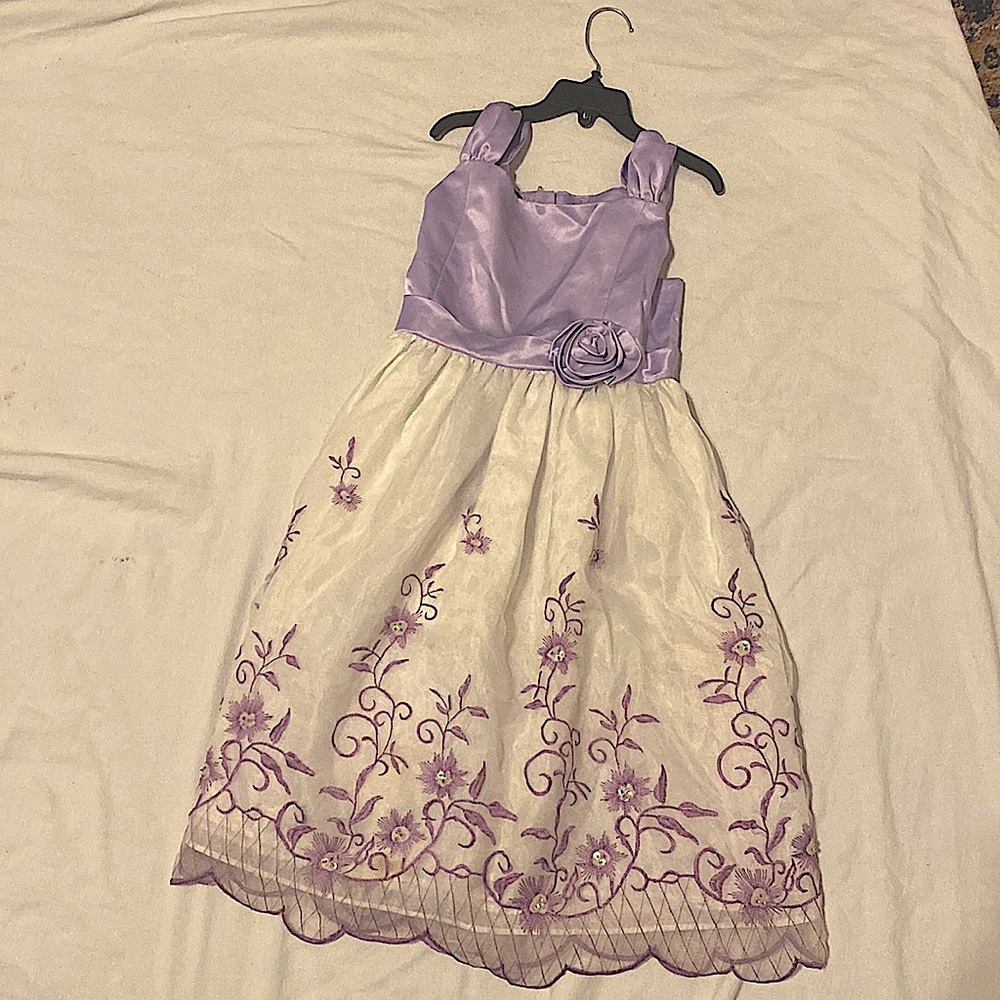 A purple and white Holiday Edition dress with rhinestones